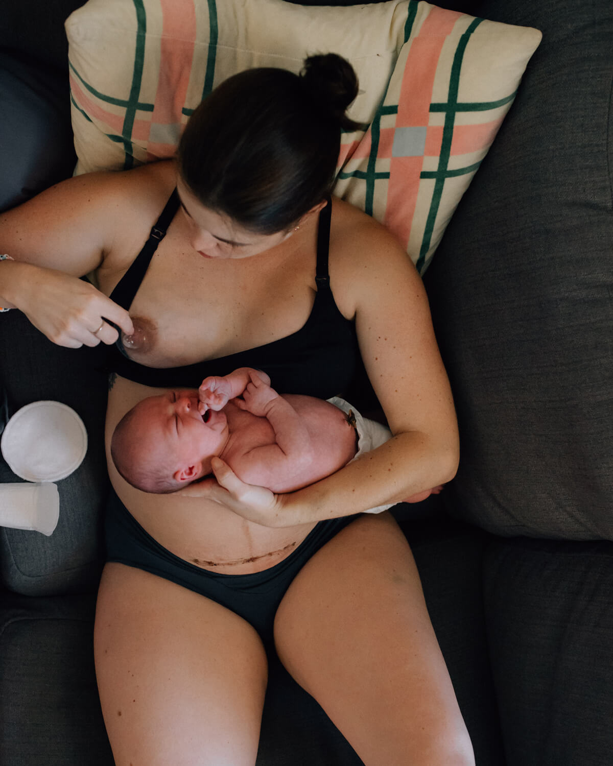 woman breastfeeding wearing a multi-cup fitting bra
